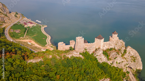 Aerial photography of Golubac fortress located on the Serbian side of the Danube river. Photography was shot from a drone with the Danube river in the background. photo