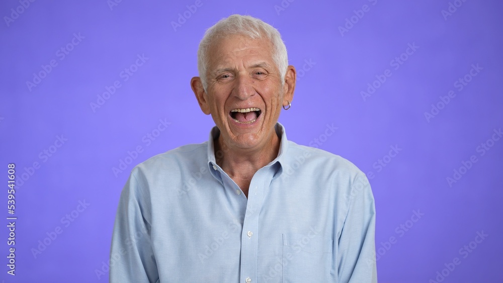 Portrait of a smiling laughing handsome middle aged man 70s. Mature caucasian man showing real emotions being happy, confident and likable. Portrait of a smiling laughing handsome middle aged man 70s. Mature caucasian man showing real emotions being happy, confident and likable.