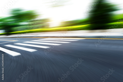 Blurred motion empty city road zebra crossing