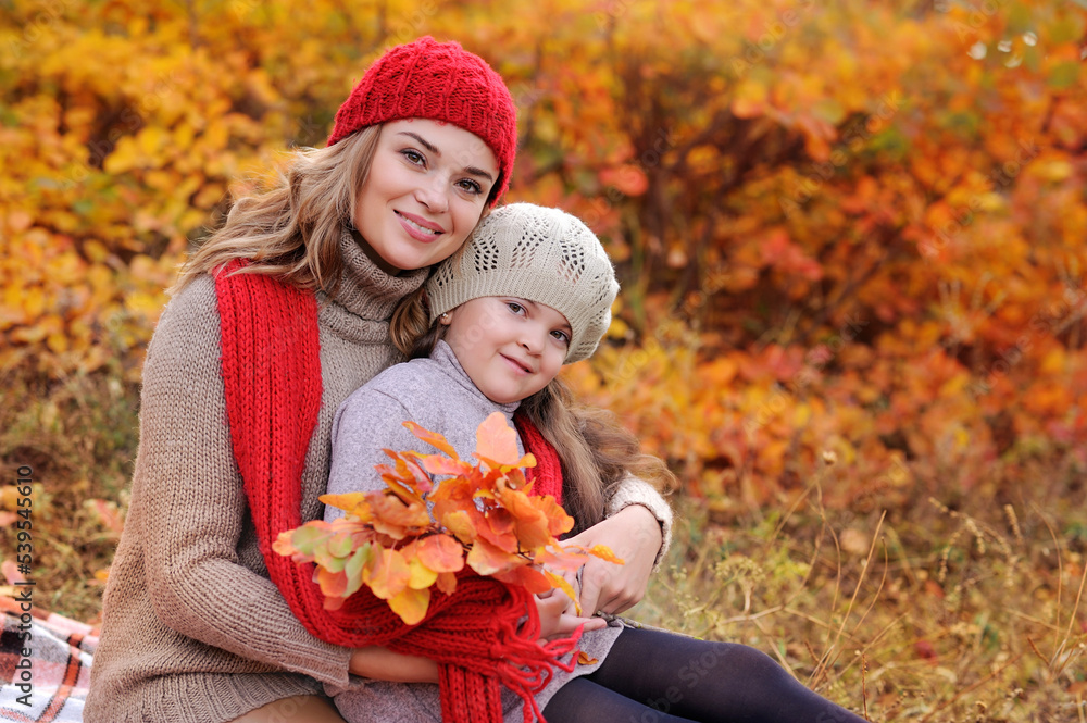 Mother and daughter wearing knitted hats Mother and daughter wearing knitted hats