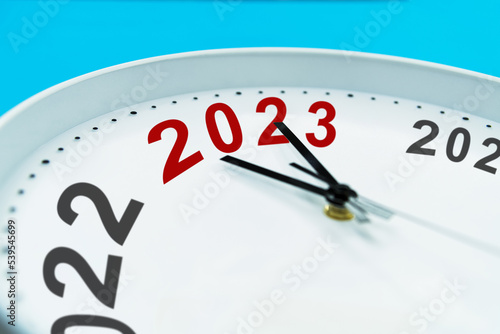 New year number 2022 and 2023 on clock