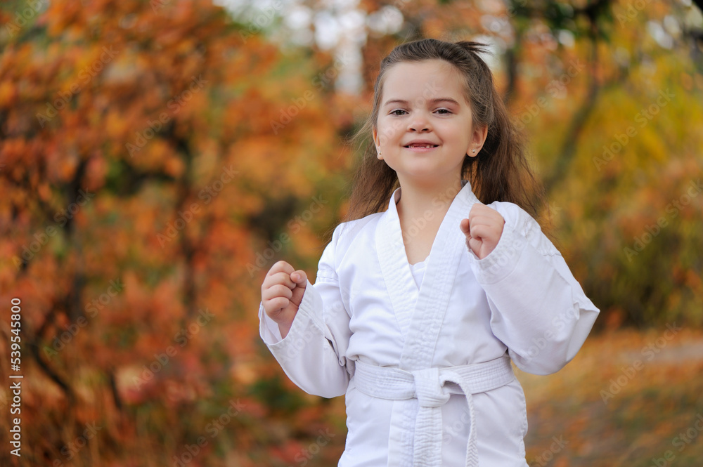 Sportive child showing fists ready for the punch Sportive child showing fists ready for the punch