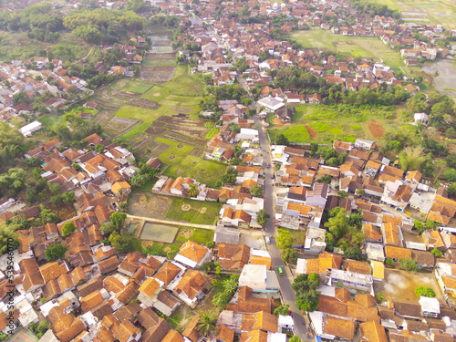 Abstract Defocused Blurred Background Aerial Cikancung area which is densely populated with houses and surrounded by rice fields. Not Focus
