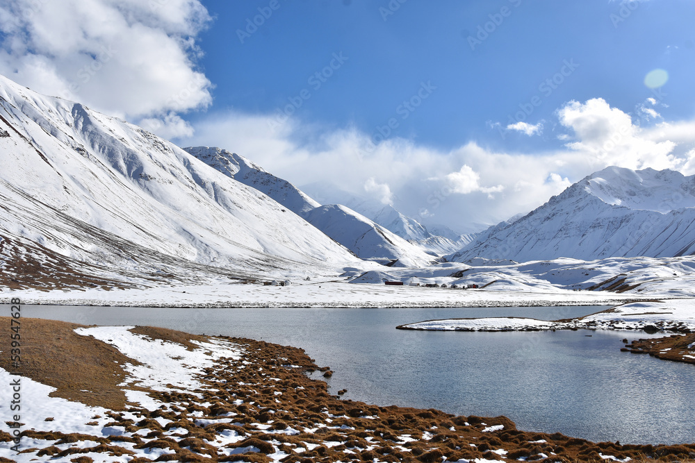 Fototapeta premium Sacred Alpine Lake Turpal-Kul in the Pamir Mountains at the foot of Lenin Peak in Kyrgyzstan