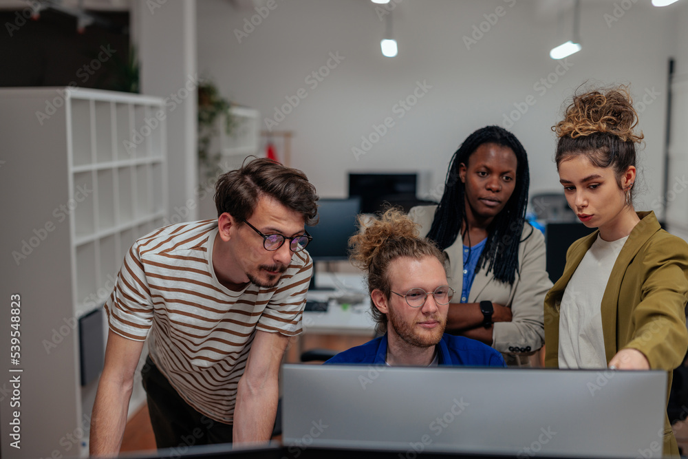 Multiracial colleagues brainstorming in office