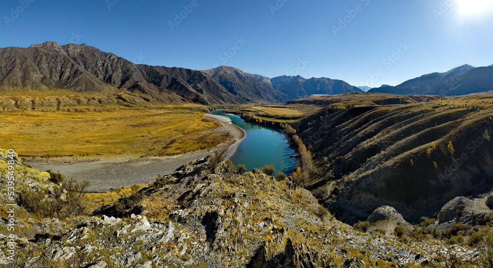 Russia. South of Western Siberia, the Altai Mountains. Picturesque high-altitude view in autumn colors of the Katun River near the village of Inegen.