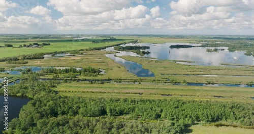 Aerial view of national park De Alde Feanen with reedland, trees and lakes with boats, Earnewald, Friesland, Netherlands photo