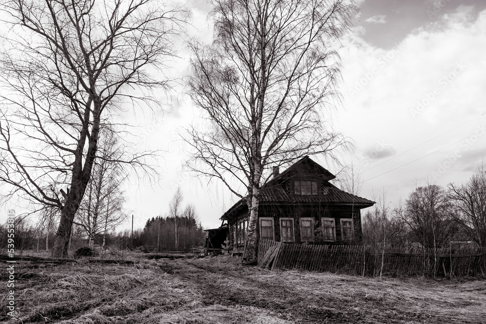 Obraz premium abandoned village in the outback of poor Russia, black and white photo