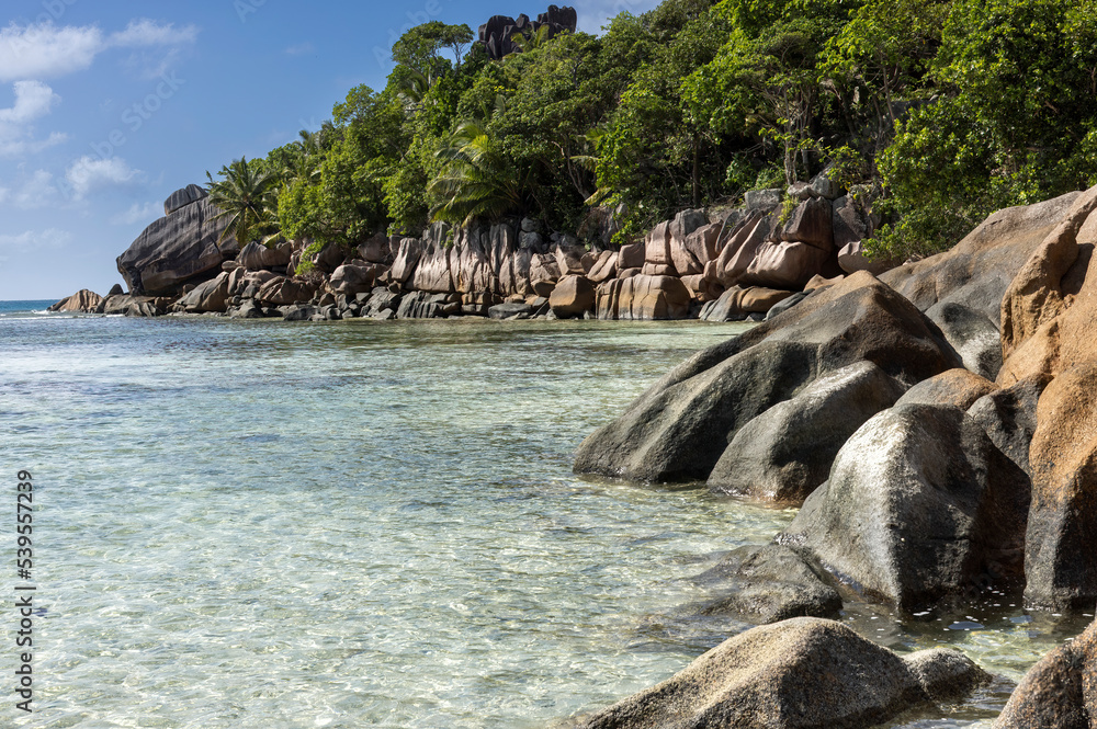 Granite Rocks at a tropical  beach on island La Digue in Seychellese