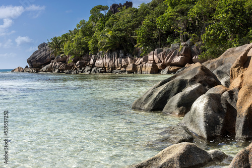 Granite Rocks at a tropical  beach on island La Digue in Seychellese © luciano