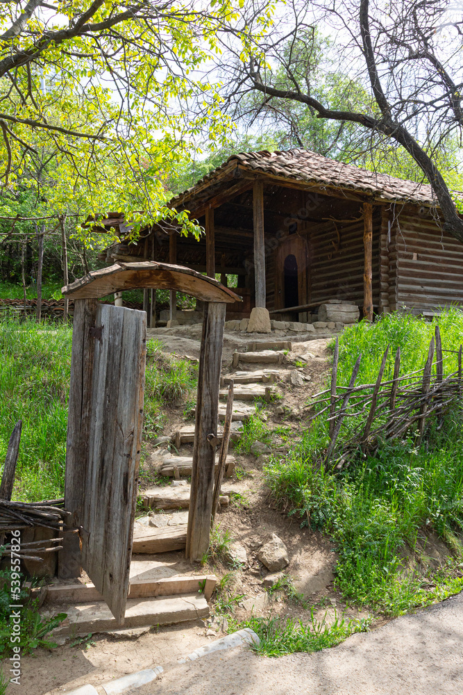 Traditional Georgian historic wooden house on top of the hill Traditional Georgian historic wooden house on top of the hill