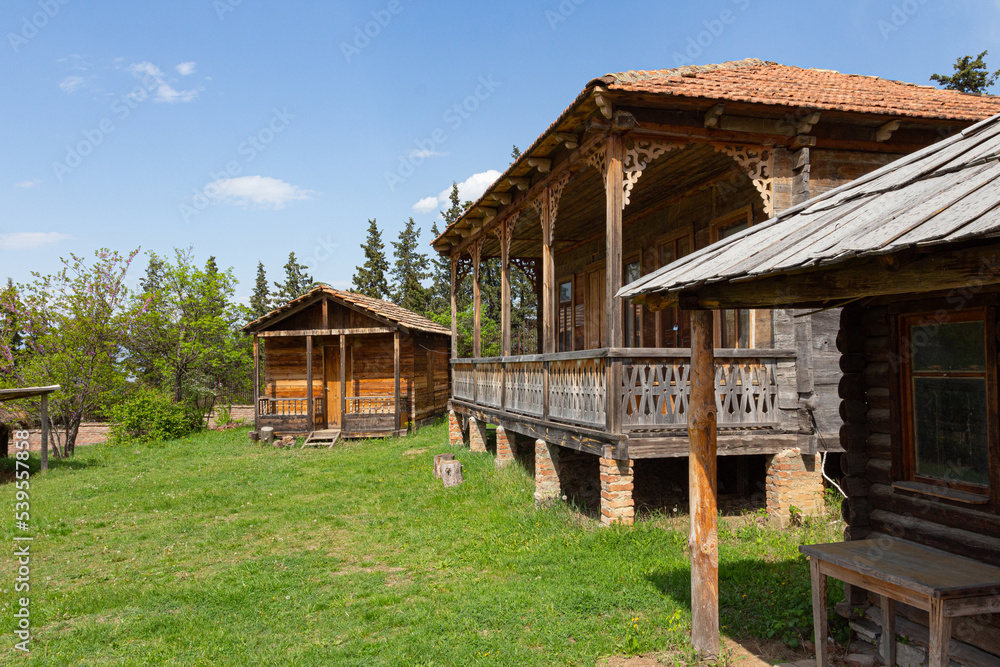 Traditional Georgian historic wooden house on top of the hill
