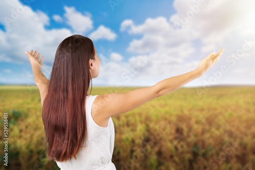 Woman open arms at nature feel free