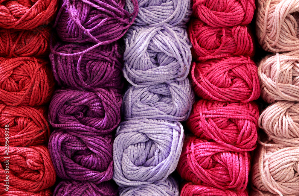 background of many balls of fabric for sale in haberdashery shop background of many balls of fabric for sale in haberdashery shop