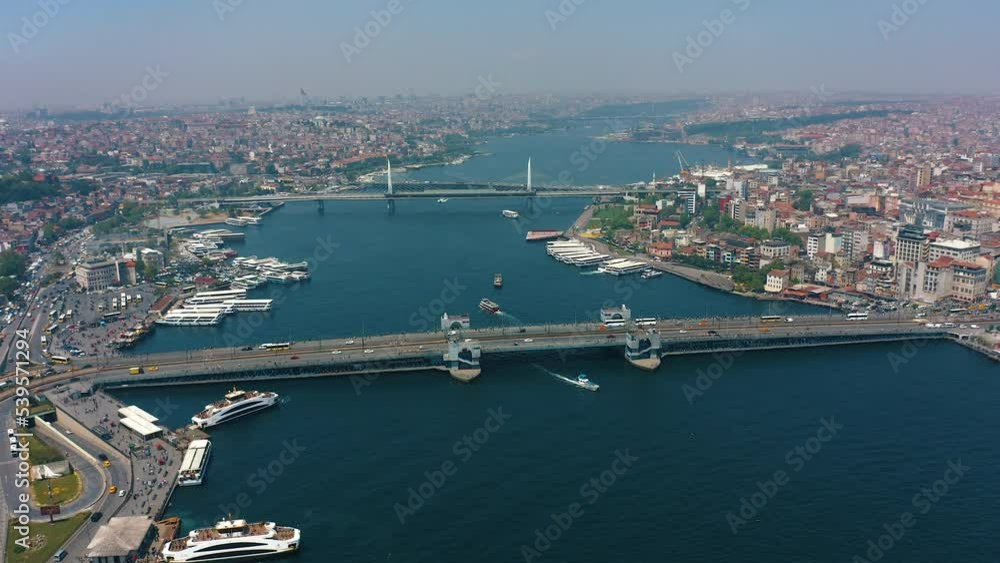 Downtown of Istanbul, Turkey from above: Galata Bridge with transport traffic, ferryboats, and ships sailing, Eminonu and Karakoy pier, Aerial drone view at sunny day Downtown of Istanbul, Turkey from above: Galata Bridge with transport traffic, ferryboats, and ships sailing, Eminonu and Karakoy pier, Aerial drone view at sunny day