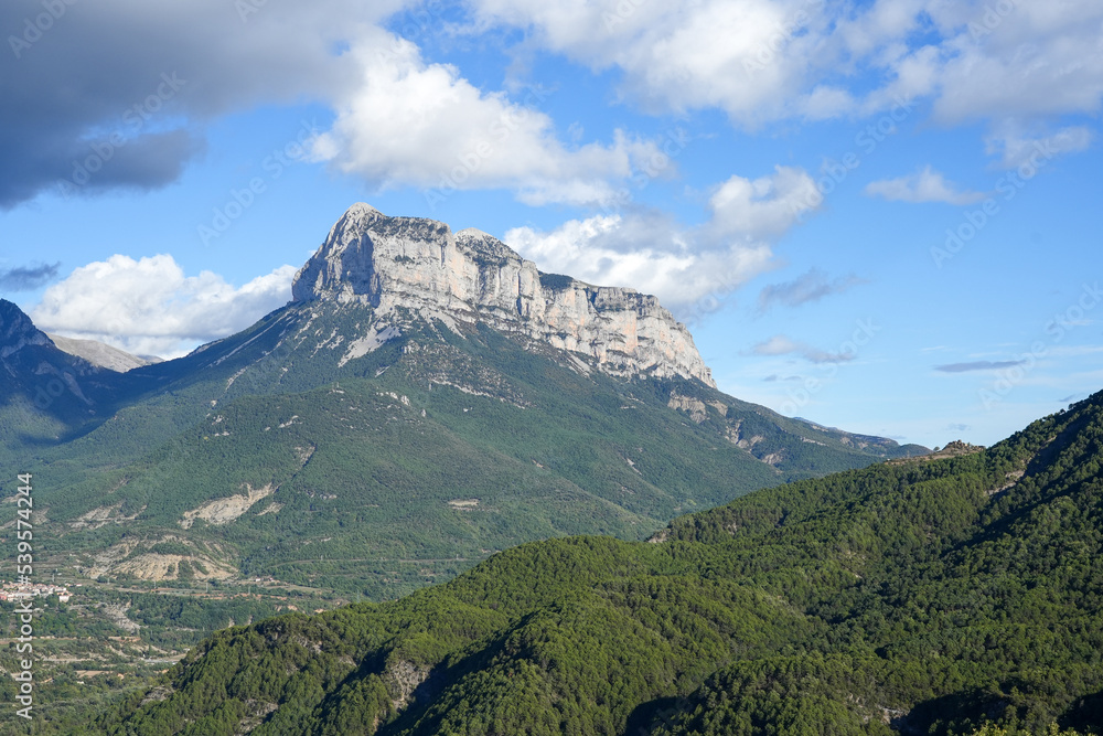 Fototapeta premium magnificent view of Pyrenees mountains with rock outcrops and forest covered slopes