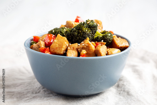 Homemade One-Pan Chicken And Broccoli Stir-Fry in a Bowl, side view. Close-up.