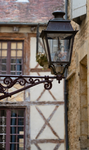 Wallpaper Mural old black cast iron street lamps fitted with modern LED bulbs in a medieval town Torontodigital.ca