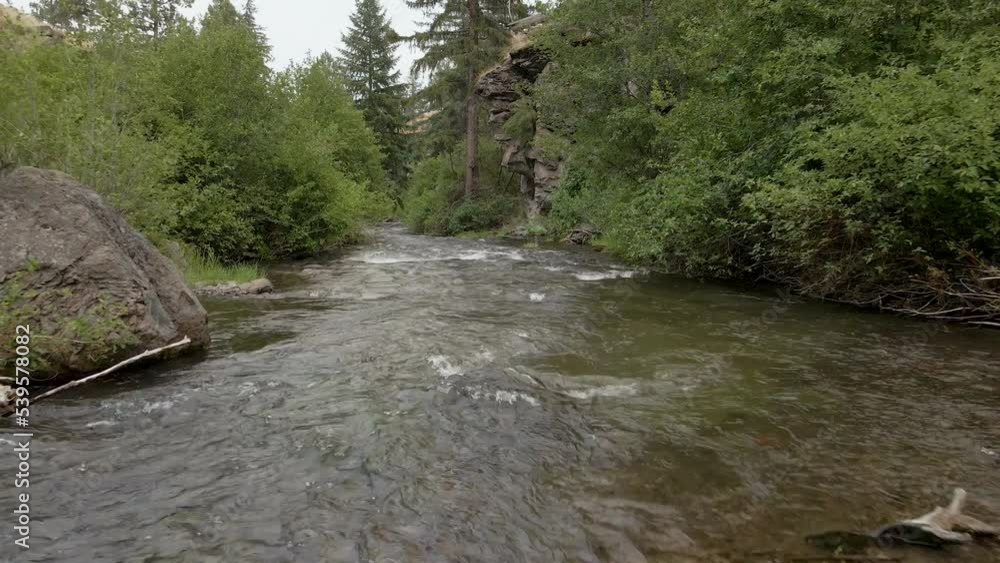 flying over a river and rocks in the forest flying over a river and rocks in the forest