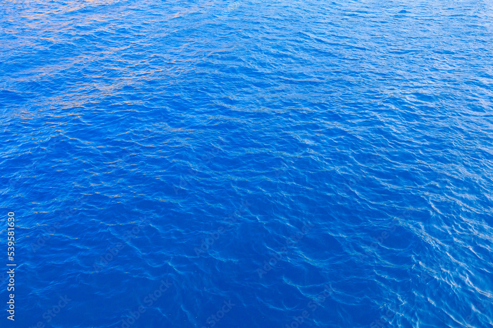 Very nice sea water background or backdrop with selective focus. Small waves of natural water surface texture. Very nice sea water background or backdrop with selective focus. Small waves of natural water surface texture.