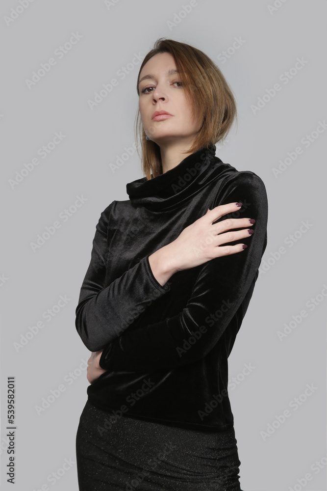Serie of studio photos of female model wearing plush black turtleneck, elegant yet cozy and warm clothng. Serie of studio photos of female model wearing plush black turtleneck, elegant yet cozy and warm clothng.
