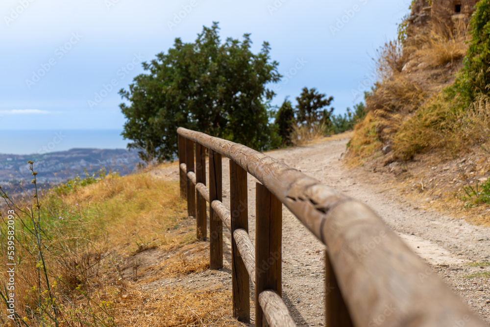 Wooden fence on Mediterranean sea background in Mijas, Spain