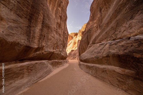 Fototapeta Naklejka Na Ścianę i Meble -  Scenic view of a path amid red canyons in the desert