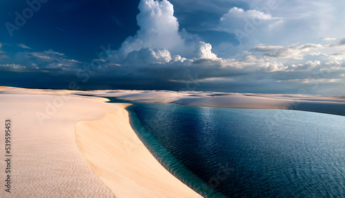 This beautiful lagoon is located in Lencois Maranhenses national park in the state of Maranhao in Brazil. There are thousands of white sand dunes, between which are fresh water lagoons. photo