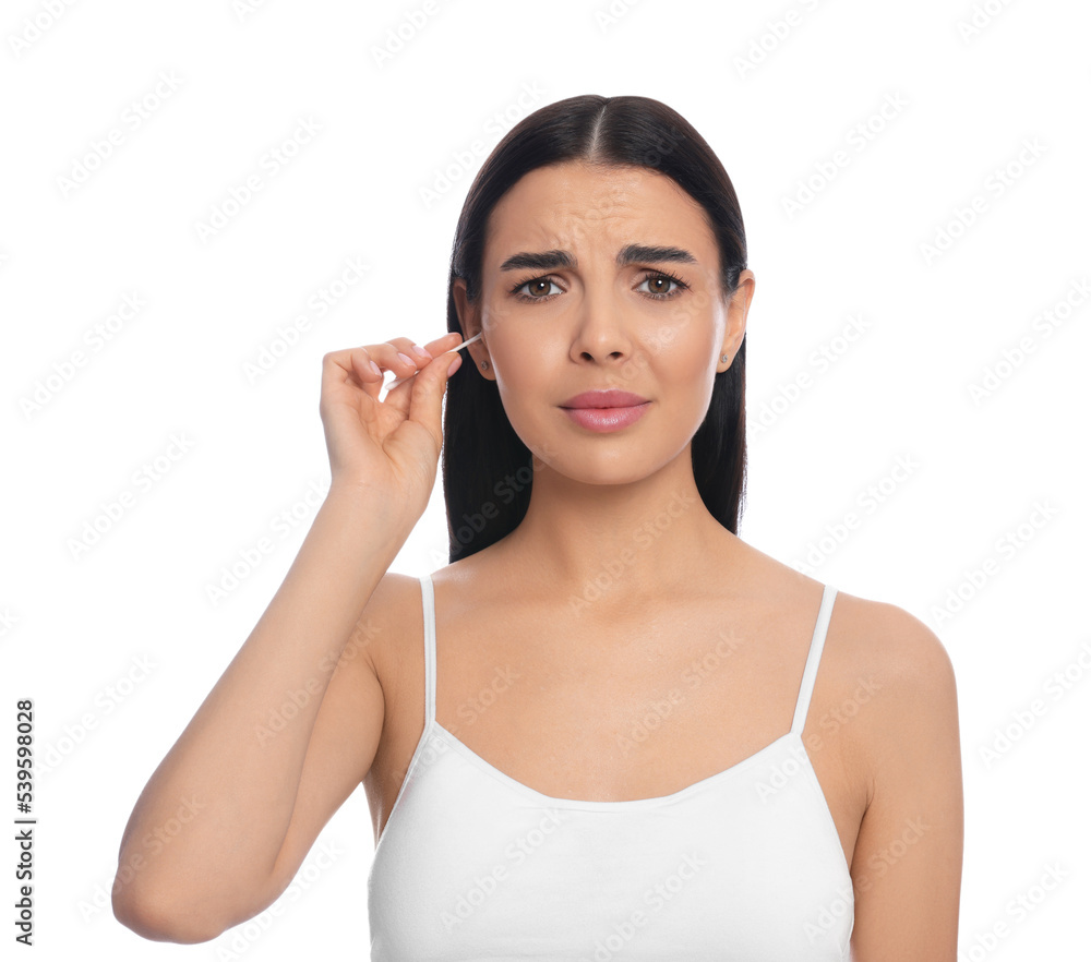 Young woman cleaning ear with cotton swab on white background Young woman cleaning ear with cotton swab on white background
