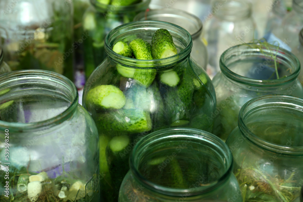 Glass jar with fresh cucumbers, closeup. Pickling vegetables Glass jar with fresh cucumbers, closeup. Pickling vegetables