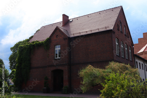 Fototapeta Naklejka Na Ścianę i Meble -  Beautiful house with brown roof against blue sky