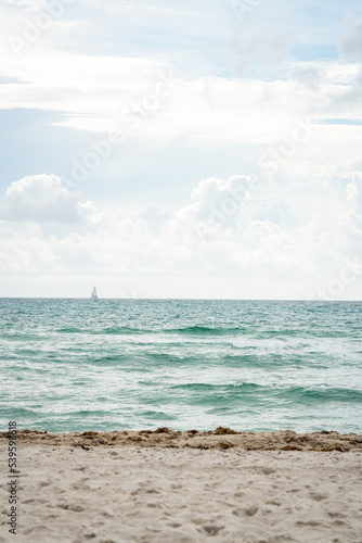 Distant Sailboat on a Beach