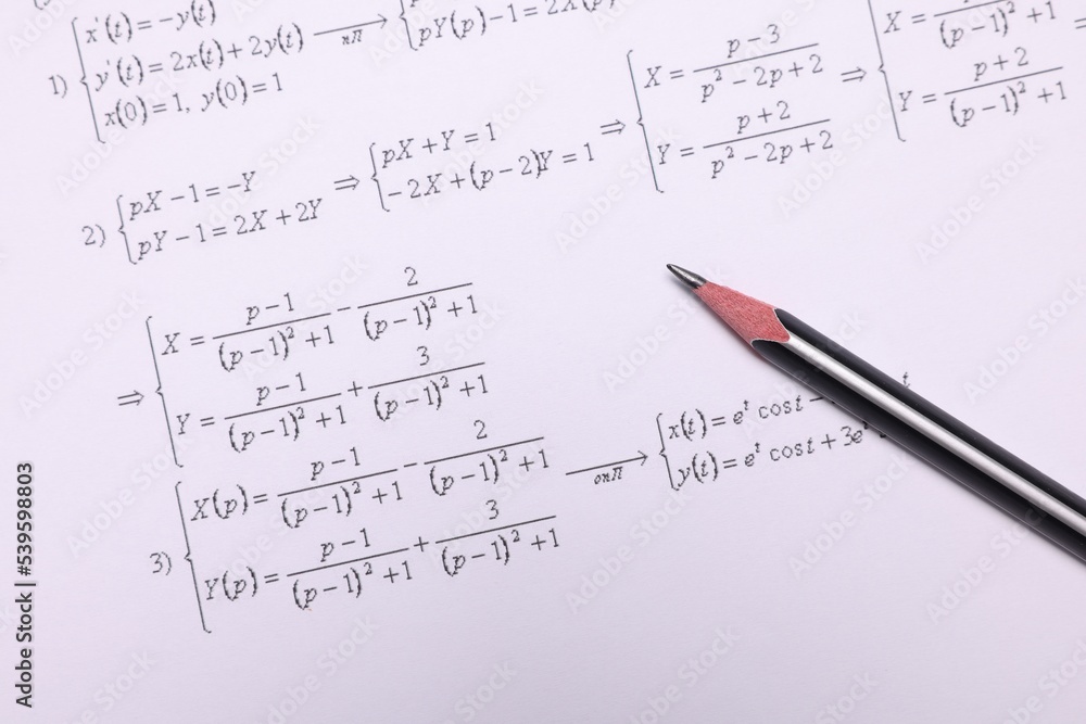 Sheet of paper with mathematical formulas and pencil, top view Sheet of paper with mathematical formulas and pencil, top view