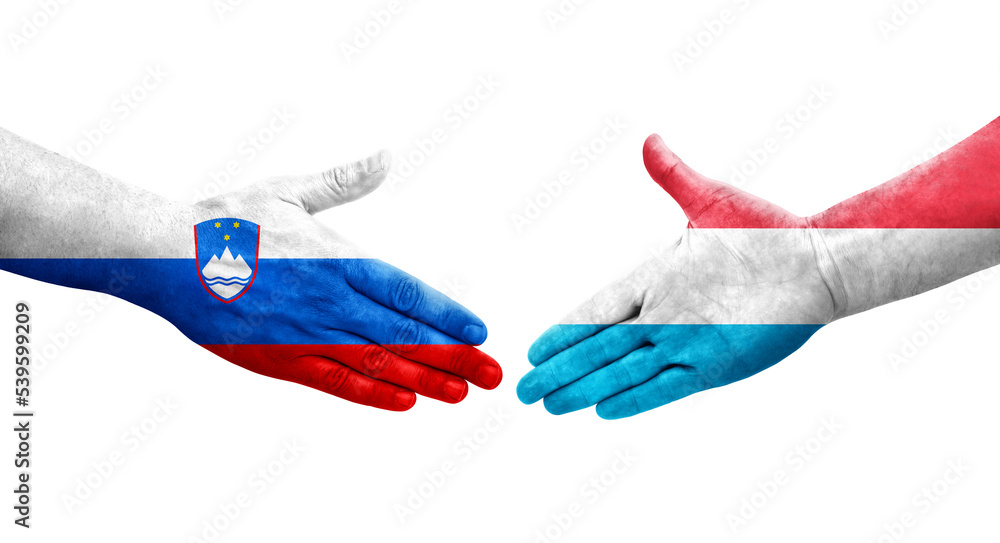 Handshake between Luxembourg and Slovenia flags painted on hands, isolated transparent image. Handshake between Luxembourg and Slovenia flags painted on hands, isolated transparent image.