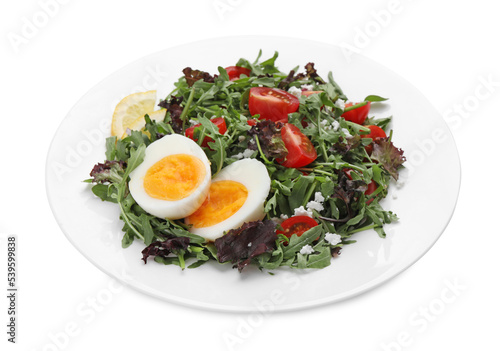Delicious salad with boiled egg, arugula and tomatoes isolated on white