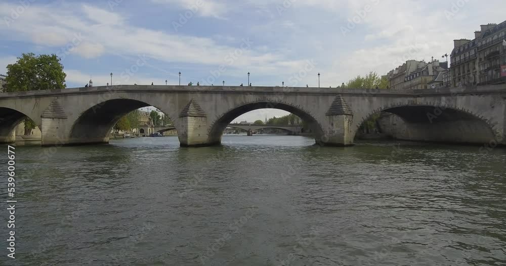 Bateau-mouche sailing on the Seine and passing under the Pont Royal toward the Pont du Carrousel along the Louvre museum in Paris. Bateau-mouche sailing on the Seine and passing under the Pont Royal toward the Pont du Carrousel along the Louvre museum in Paris.