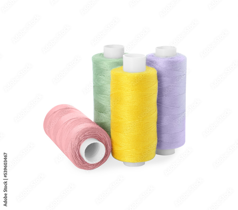 Many different colorful sewing threads on white background Many different colorful sewing threads on white background