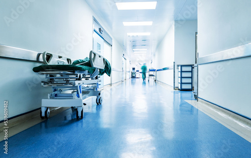 Fotografie Doctors or nurses walking in hospital hallway, blurred motion