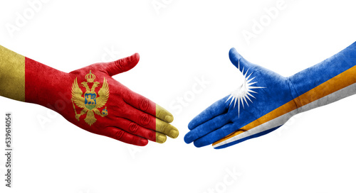 Handshake between Marshall Islands and Montenegro flags painted on hands, isolated transparent image.