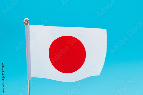 Free Download Japanese flag waving on blue background - GFXLoad