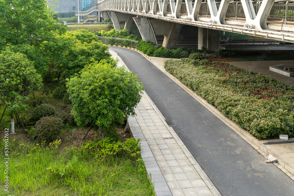 Concrete structure and asphalt road space under the overpass in the city Concrete structure and asphalt road space under the overpass in the city