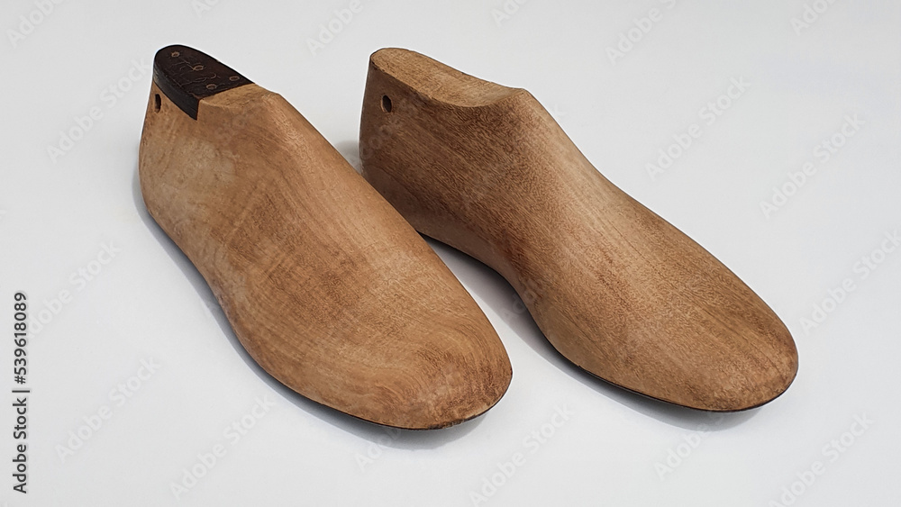 A pair of antique wooden shoe form used by shoemakers in the manufacture of shoes for adults and children. Modeling. A pair of antique wooden shoe form used by shoemakers in the manufacture of shoes for adults and children. Modeling.