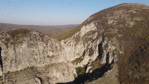 Stone rocks of the Nisevac near Svrljig in Serbia cliff and gorge rock on the mountain range in sunny day Aerial drone video over the hill photo