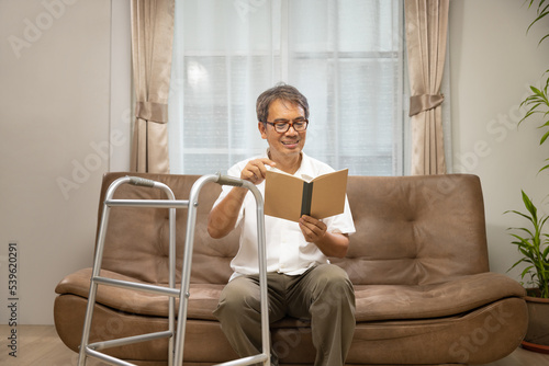 Sarcopenia older man is reading a book for relax at nursinghome . Sarcopenia is a degenerative disease of the muscle usually caused by the natural consequence of aging. photo