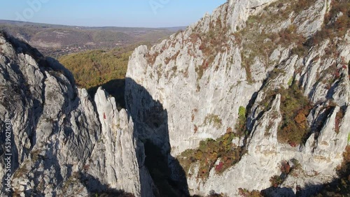 Stone rocks of the Nisevac near Svrljig in Serbia cliff and gorge rock on the mountain range in sunny day Aerial drone video over the hill photo