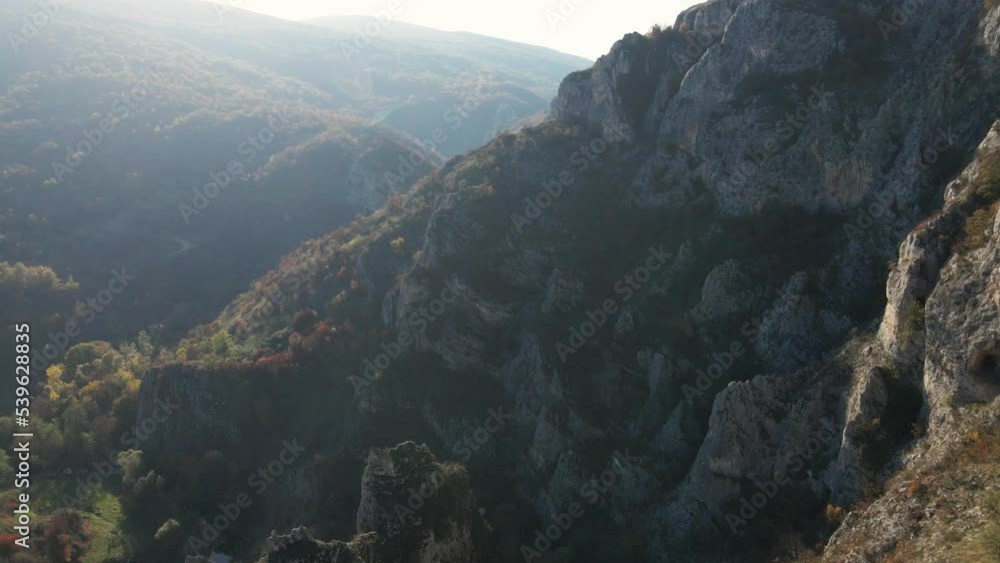 Stone rocks of the Nisevac near Svrljig in Serbia cliff and gorge rock on the mountain range in sunny day Aerial drone video over the hill Stone rocks of the Nisevac near Svrljig in Serbia cliff and gorge rock on the mountain range in sunny day Aerial drone video over the hill