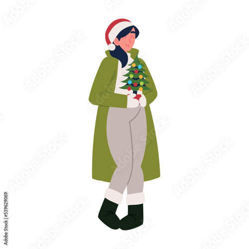 woman with little christmas tree