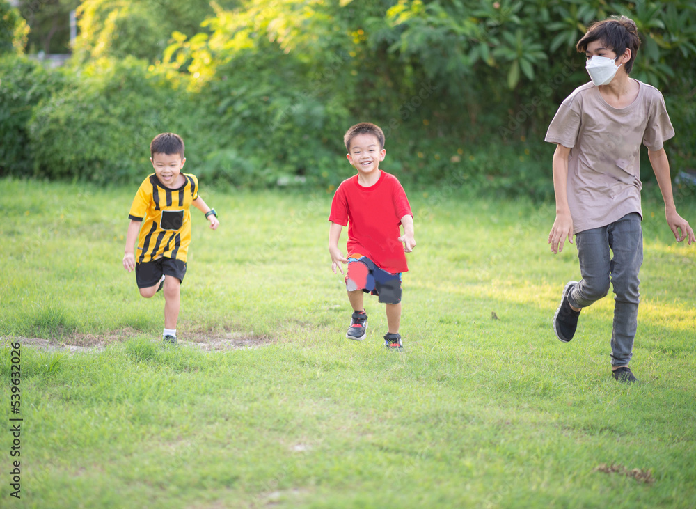 Fototapeta premium Asian Family play together at playground with happy smile