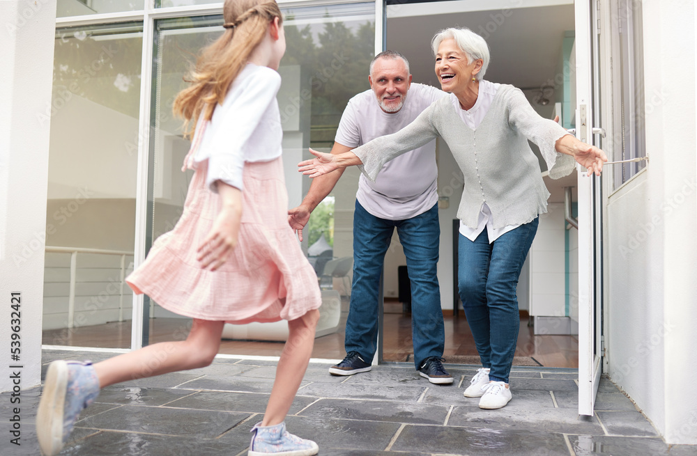 Grandparents, child and welcome for girl running to hug her grandma and