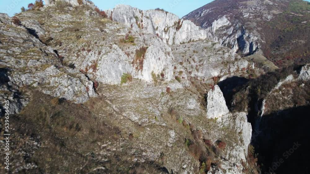 Stone rocks of the Nisevac near Svrljig in Serbia cliff and gorge rock on the mountain range in sunny day Aerial drone video over the hill Stone rocks of the Nisevac near Svrljig in Serbia cliff and gorge rock on the mountain range in sunny day Aerial drone video over the hill